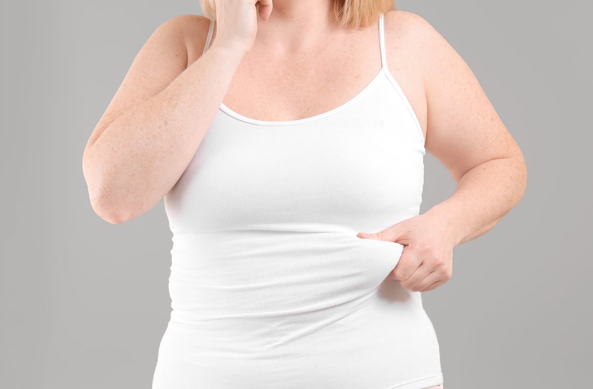 Overweight Woman on Grey Background